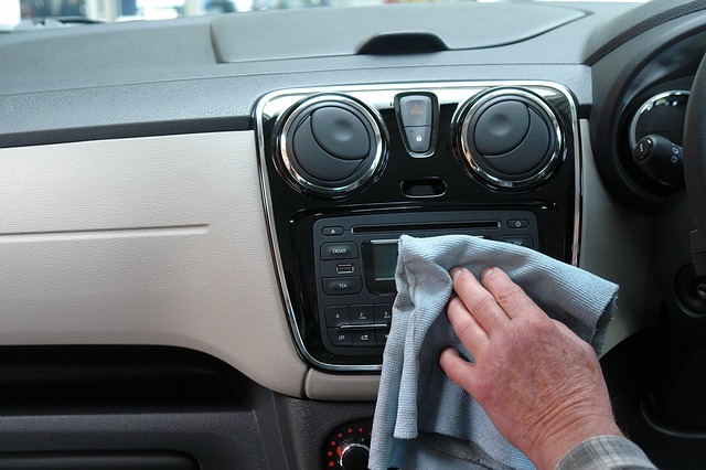 Man Wiping Centre Console